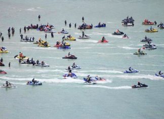 Some of the 84 adventurous jet ski riders prepare to set out across the Gulf of Thailand.